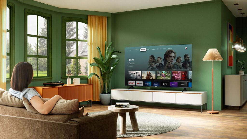 a woman watches her Hisense TV