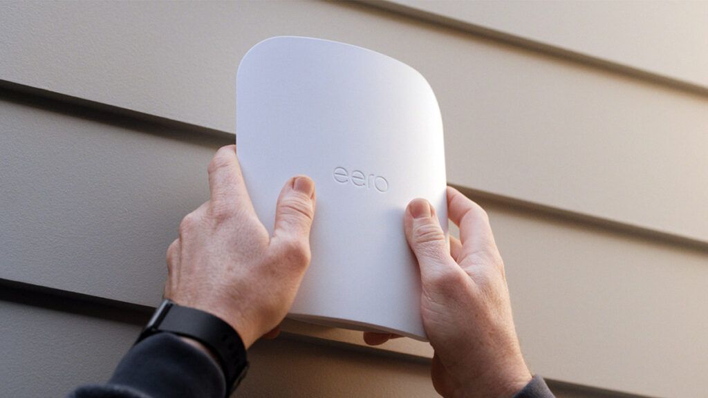 photo of installation of Eero Outdoor 7 on the outside of a home