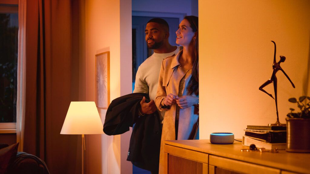 a couple walks into a well lit home